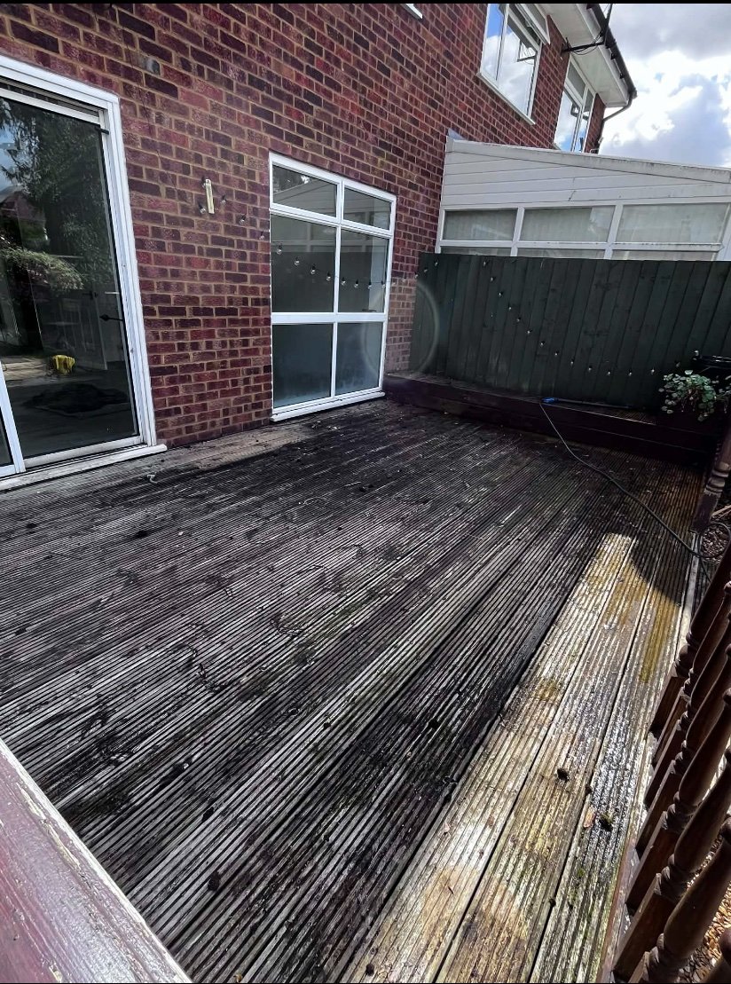 Before image of a dirty decking area.